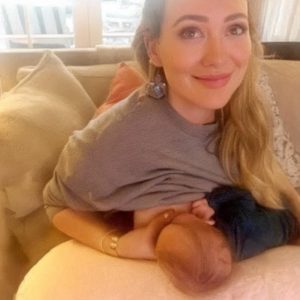 At first glance, this photo may seem innocent, just a mother breastfeeding her baby. But take a closer look, and you’ll notice the hidden detail that caused it to go viral. Find out the full story in the comments section below.