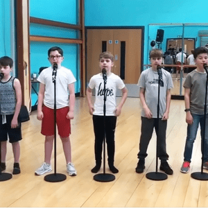 During a rehearsal, 5 young boys are preparing for performance that could change their lives completely!